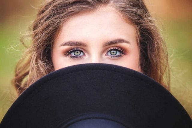 Senior Portraits: Senior with Hat and Green Eyes